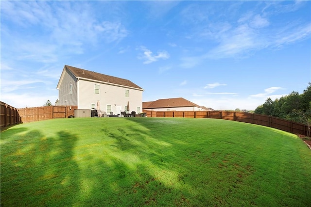 view of yard with a fenced backyard
