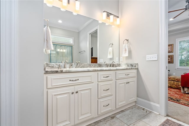 1843 Yarbrough Farms Blvd, Auburn, AL 36830 - ensuite bathroom featuring ornamental molding, double vanity, baseboards, and a ceiling fan