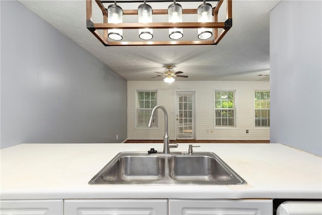 2428 E University Dr Unit 904, Auburn, AL 36830 - kitchen featuring a sink, light countertops, and white cabinets