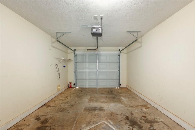 2428 E University Dr Unit 904, Auburn, AL 36830 - garage with baseboards and a garage door opener