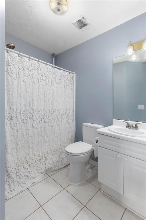 2428 E University Dr Unit 904, Auburn, AL 36830 - full bathroom featuring toilet, vanity, tile patterned flooring, and a shower with curtain