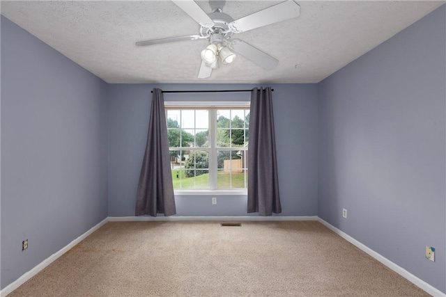 2428 E University Dr Unit 904, Auburn, AL 36830 - empty room with light carpet, baseboards, ceiling fan, and a textured ceiling