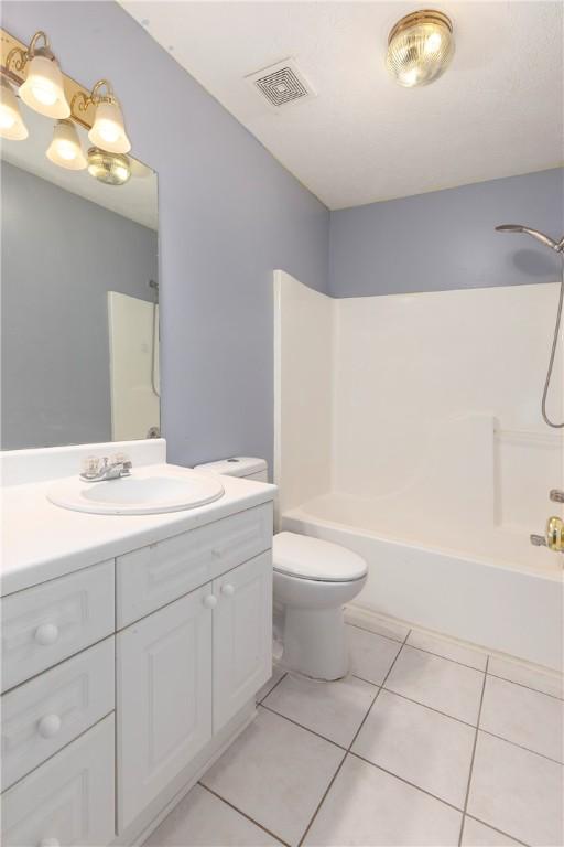 2428 E University Dr Unit 904, Auburn, AL 36830 - full bath with tile patterned floors, vanity, shower / tub combination, and toilet