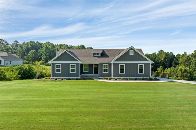 view of front facade featuring a front lawn and board and batten siding