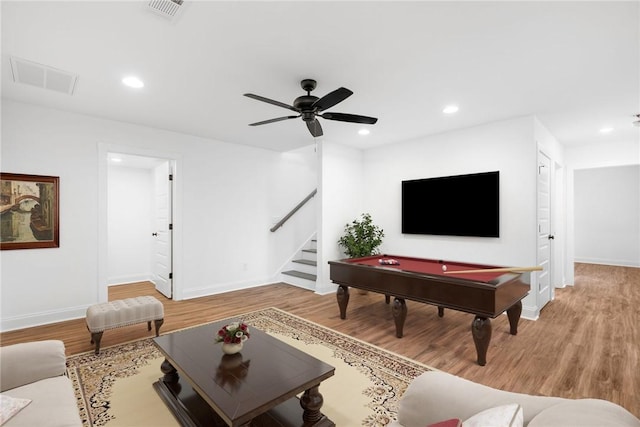 living room featuring visible vents, recessed lighting, stairway, and wood finished floors