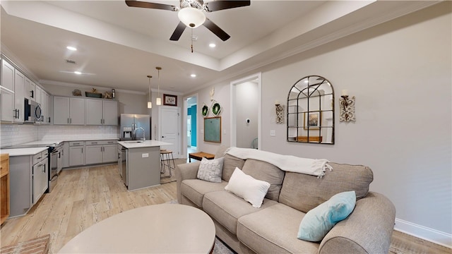 574 Grey Oak Cir, Auburn, AL 36830 - living room with light wood finished floors, ceiling fan, ornamental molding, and recessed lighting