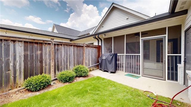 574 Grey Oak Cir, Auburn, AL 36830 - view of yard featuring a sunroom and a ceiling fan
