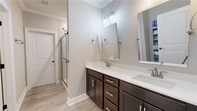 574 Grey Oak Cir, Auburn, AL 36830 - full bath with crown molding, double vanity, wood finished floors, and a stall shower