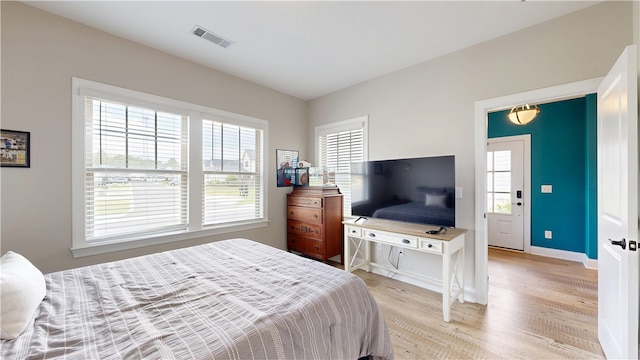 574 Grey Oak Cir, Auburn, AL 36830 - bedroom with multiple windows and light wood-style floors