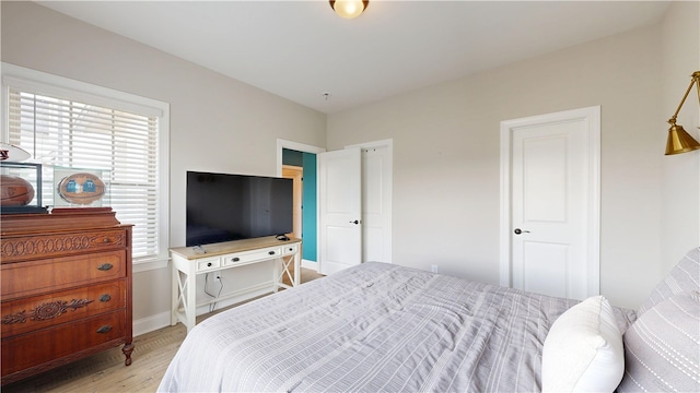 574 Grey Oak Cir, Auburn, AL 36830 - bedroom featuring light wood-style flooring and baseboards