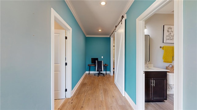 574 Grey Oak Cir, Auburn, AL 36830 - hallway featuring a barn door, light wood-style flooring, ornamental molding, recessed lighting, and an office area