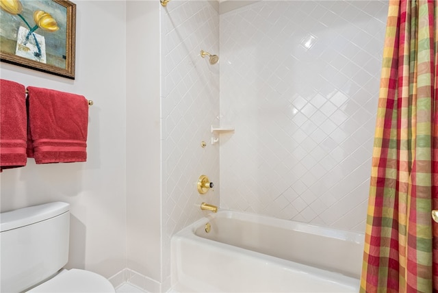 bathroom with toilet and shower / tub combo