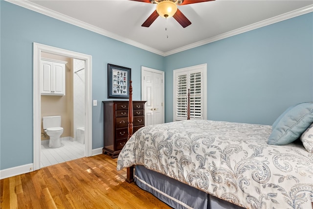 bedroom with ceiling fan, light wood-type flooring, crown molding, and connected bathroom