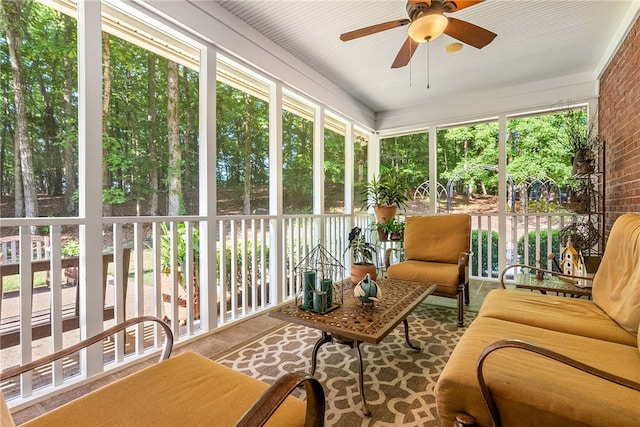 sunroom / solarium with ceiling fan