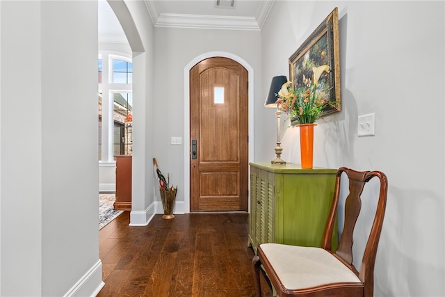 foyer entrance featuring crown molding and dark hardwood / wood-style floors