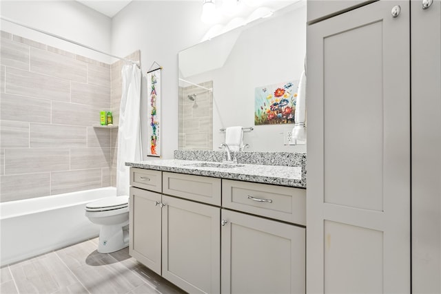 full bathroom featuring shower / bath combination with curtain, vanity, and toilet