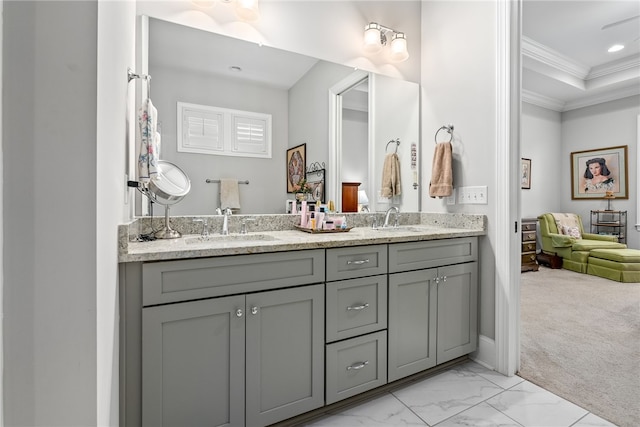 bathroom with vanity and crown molding