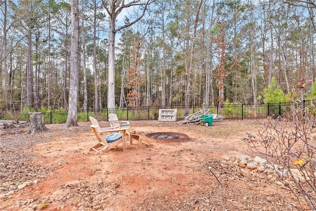 view of yard with a fire pit