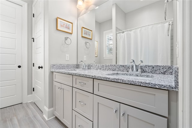 bathroom featuring vanity and walk in shower