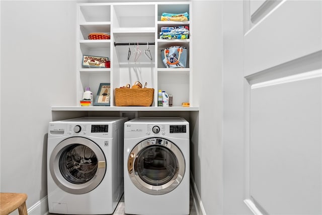 laundry room with washing machine and clothes dryer