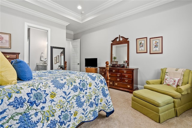 bedroom featuring light carpet, a tray ceiling, and ornamental molding