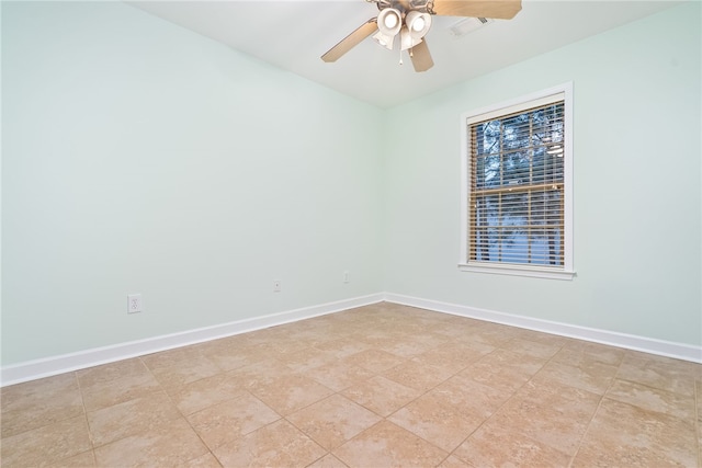 unfurnished room with ceiling fan and light tile patterned floors