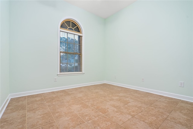 spare room featuring light tile patterned floors