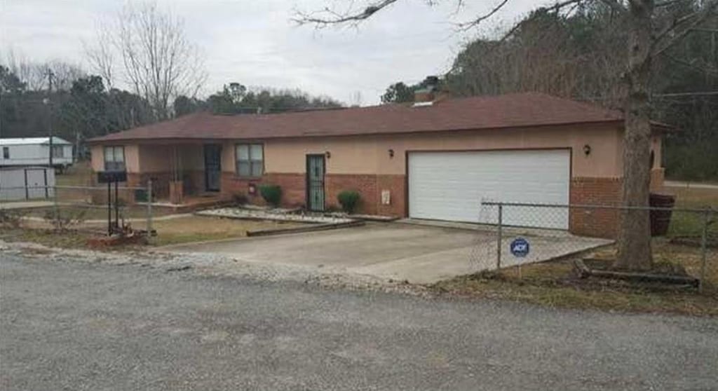 30 Bay St, Tuskegee, AL 36083 - ranch-style home with driveway, a garage, and brick siding