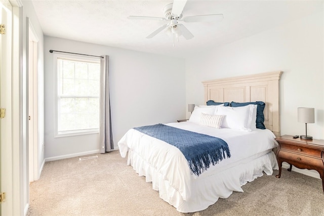 1477 N Donahue Dr N Unit 1602, Auburn, AL 36830 - bedroom featuring light colored carpet, a ceiling fan, and baseboards