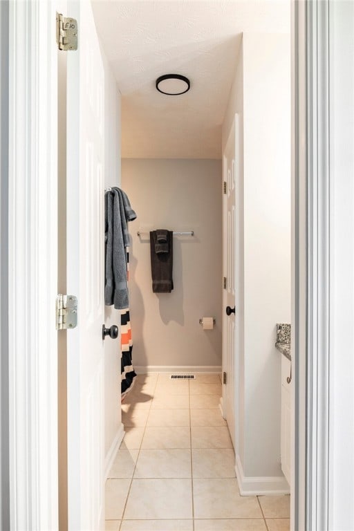 1477 N Donahue Dr N Unit 1602, Auburn, AL 36830 - bathroom featuring tile patterned flooring and baseboards