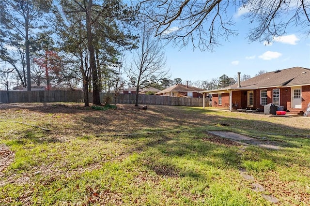 view of yard with a fenced backyard