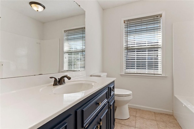 bathroom featuring shower / washtub combination, toilet, vanity, tile patterned flooring, and baseboards