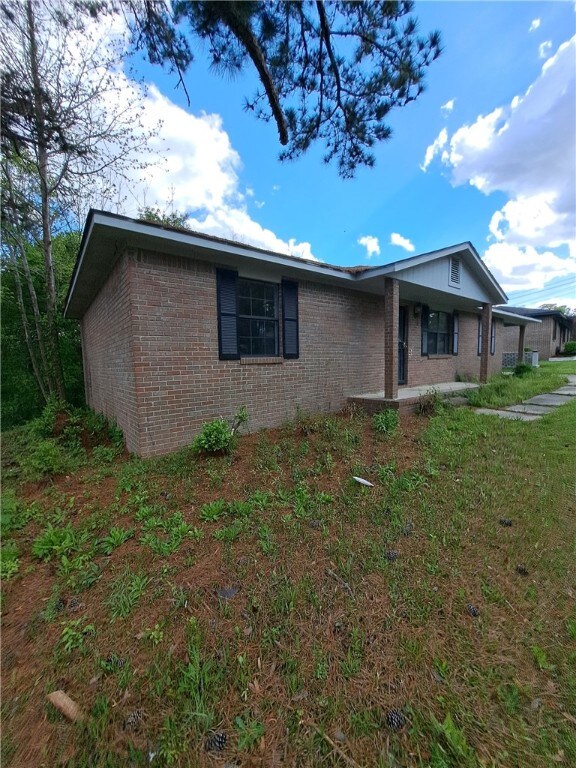 2106 Auburn St, Tuskegee, AL 36083 - view of front facade with brick siding
