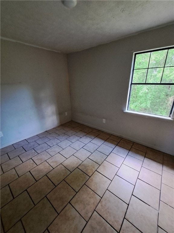 2106 Auburn St, Tuskegee, AL 36083 - spare room with a textured ceiling