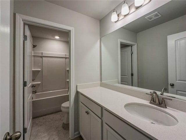 full bath with visible vents, toilet, washtub / shower combination, vanity, and tile patterned floors