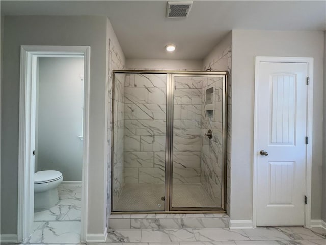 bathroom with toilet, visible vents, baseboards, marble finish floor, and a shower stall