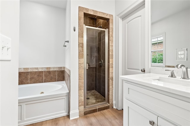1756 Vfw Rd, Auburn, AL 36832 - full bath with a stall shower, a garden tub, vanity, and wood finished floors