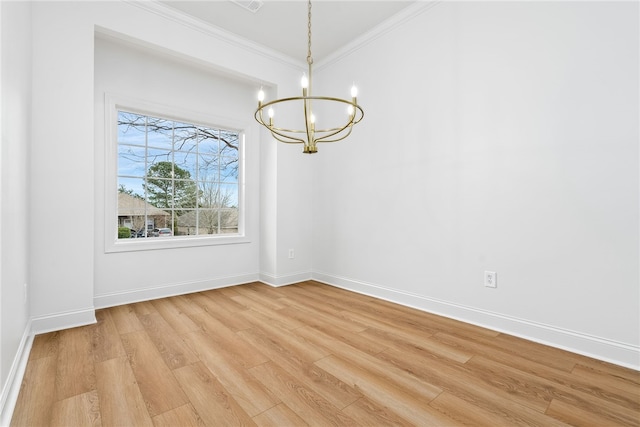 1756 Vfw Rd, Auburn, AL 36832 - empty room featuring a chandelier, crown molding, and light wood-style flooring