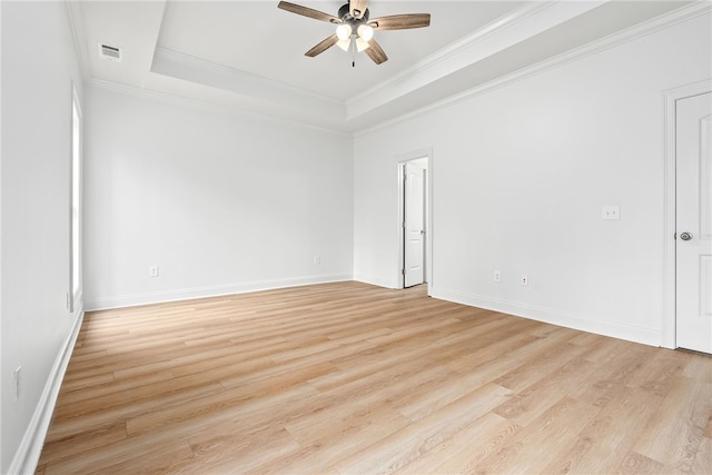 1756 Vfw Rd, Auburn, AL 36832 - unfurnished room featuring ceiling fan, a tray ceiling, light wood finished floors, and ornamental molding