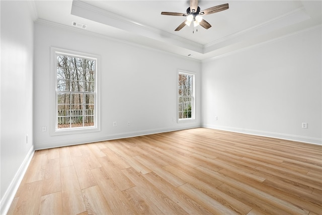 1756 Vfw Rd, Auburn, AL 36832 - spare room featuring a raised ceiling, light wood-style flooring, a ceiling fan, and ornamental molding