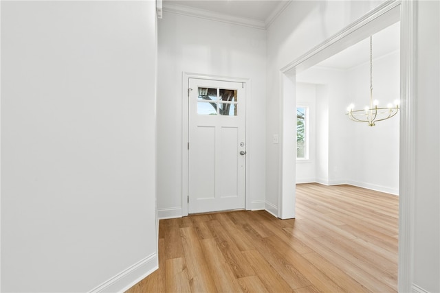 1756 Vfw Rd, Auburn, AL 36832 - foyer entrance with a chandelier, light wood finished floors, and ornamental molding