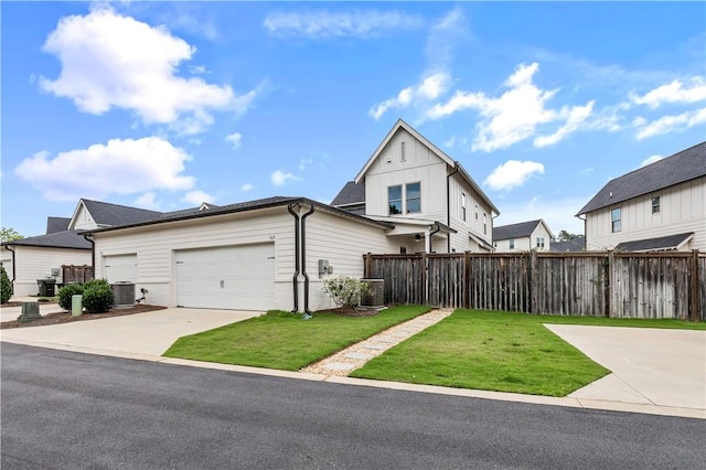 564 Grey Oak Cir, Auburn, AL 36830 - view of front facade with board and batten siding, a garage, and driveway