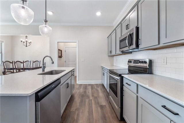 564 Grey Oak Cir, Auburn, AL 36830 - kitchen featuring stainless steel appliances, gray cabinets, crown molding, dark wood-style flooring, and backsplash