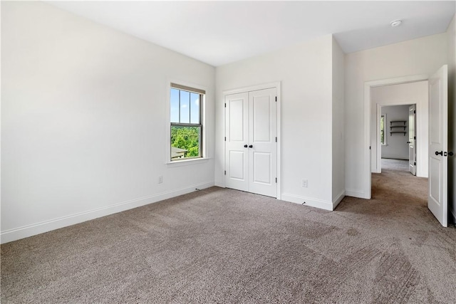 564 Grey Oak Cir, Auburn, AL 36830 - unfurnished bedroom with carpet flooring and a closet