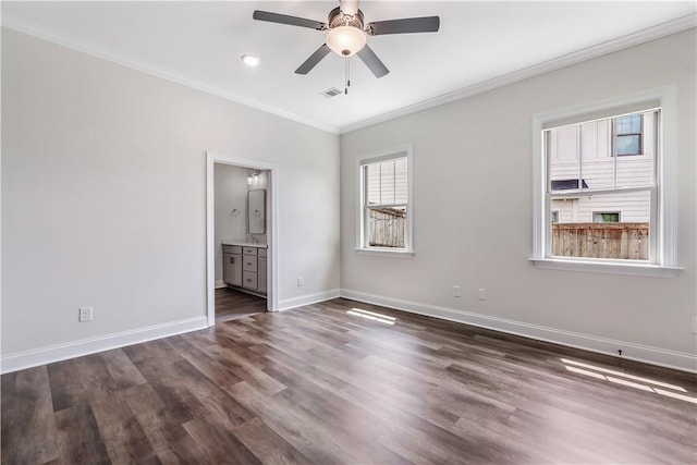 564 Grey Oak Cir, Auburn, AL 36830 - unfurnished bedroom featuring crown molding, dark wood-style floors, ensuite bathroom, and ceiling fan