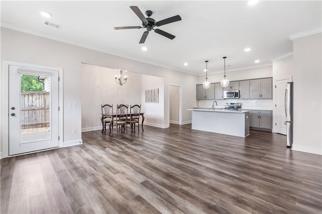 564 Grey Oak Cir, Auburn, AL 36830 - living room featuring ornamental molding, ceiling fan, recessed lighting, a chandelier, and dark wood finished floors