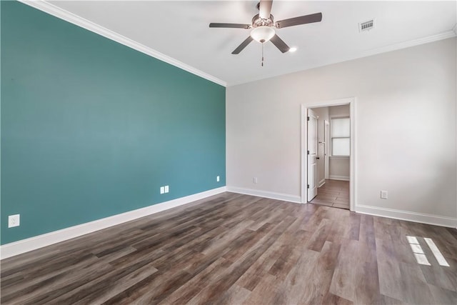 564 Grey Oak Cir, Auburn, AL 36830 - spare room featuring crown molding, ceiling fan, and dark wood-type flooring