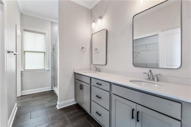 564 Grey Oak Cir, Auburn, AL 36830 - full bathroom with double vanity, a tile shower, and crown molding