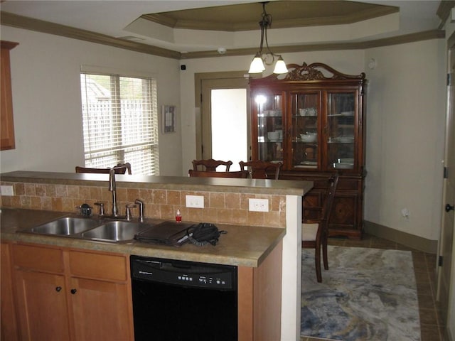 kitchen featuring a raised ceiling, decorative backsplash, sink, and black dishwasher