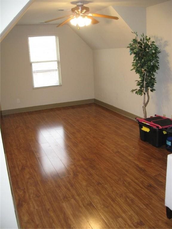 bonus room with dark hardwood / wood-style floors, ceiling fan, and lofted ceiling